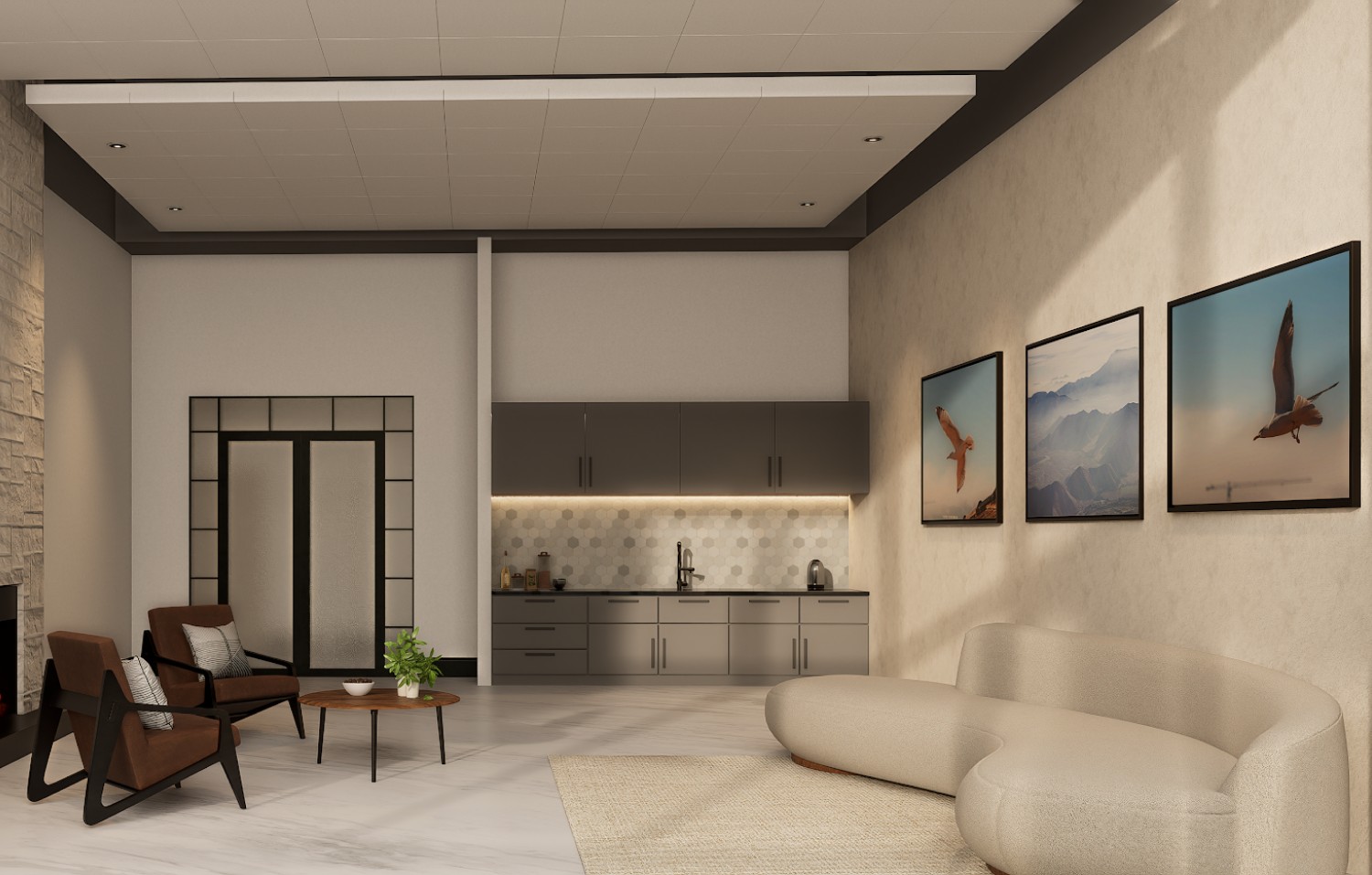 Modern living area with beige sofa, two brown chairs, a coffee table, kitchenette, and three bird-themed framed pictures on the wall.