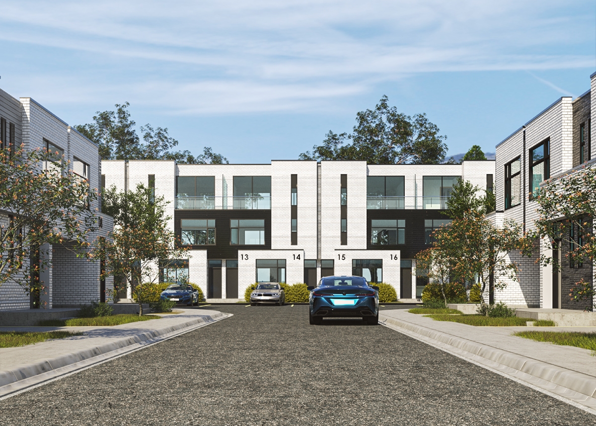 A residential street with modern white brick townhouses, cars parked along the curb, and small trees lining the sidewalk under a partly cloudy sky.