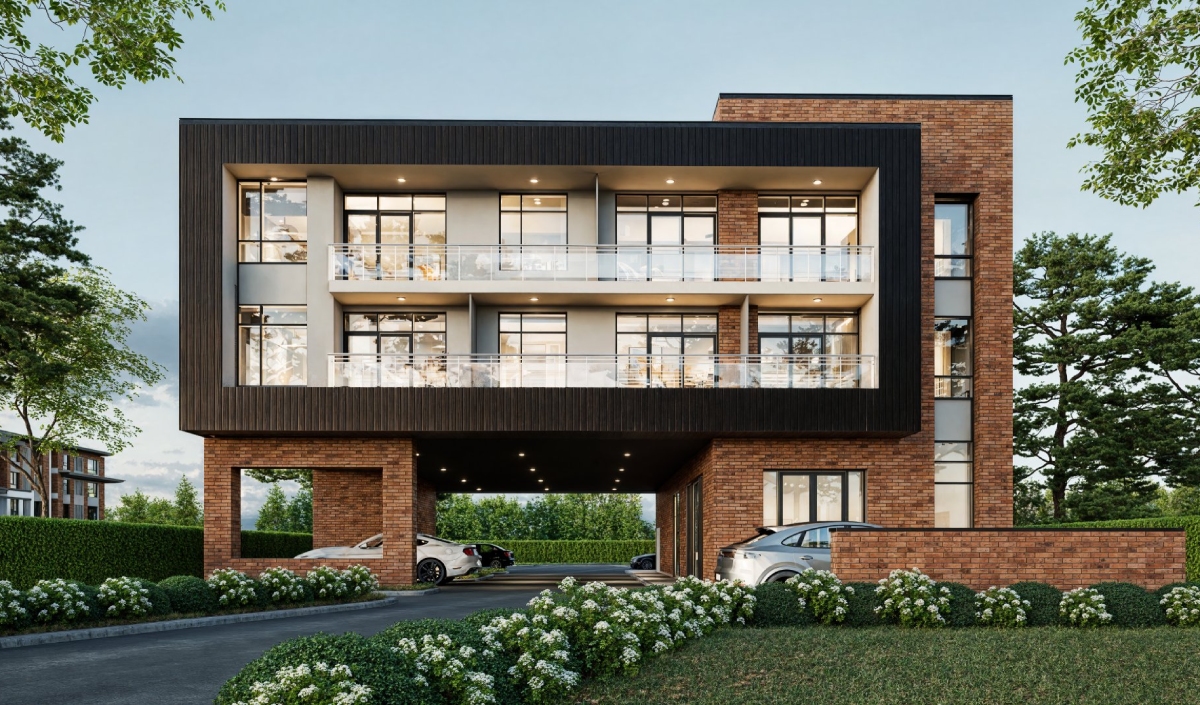 Modern three-story apartment building with large glass windows, brick and dark panel facade, and cars parked underneath, surrounded by greenery and shrubs.