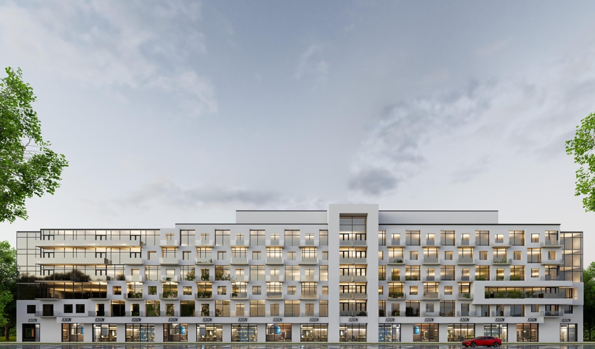 Modern multi-story apartment building with large windows, rectangular balconies, and ground-level retail spaces, viewed from the front under a cloudy sky.