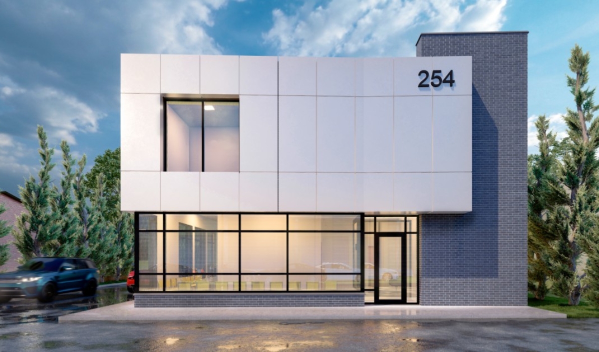 Modern two-story commercial building at 245 Dundas St E Waterdown, featuring large glass windows on the ground floor, a sleek white panel facade, and the number 254 displayed on the upper right corner.