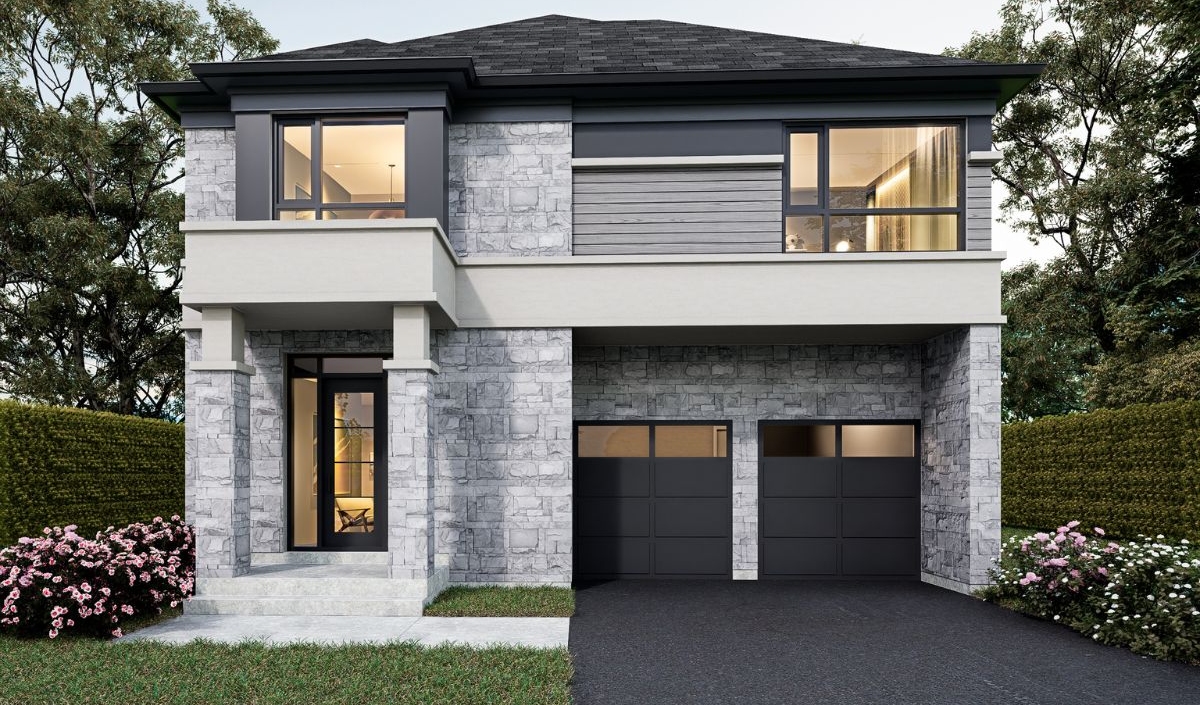 Two-story modern house with stone facade, dual garage doors, large windows, front porch, and landscaped bushes along the driveway and entry.